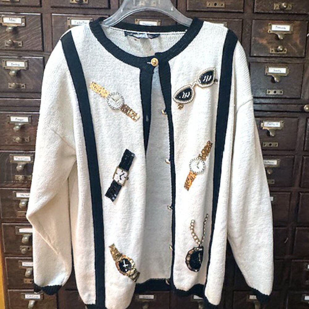 Vintage 1980's Sweater with sequined embellishments and shoulder pads.